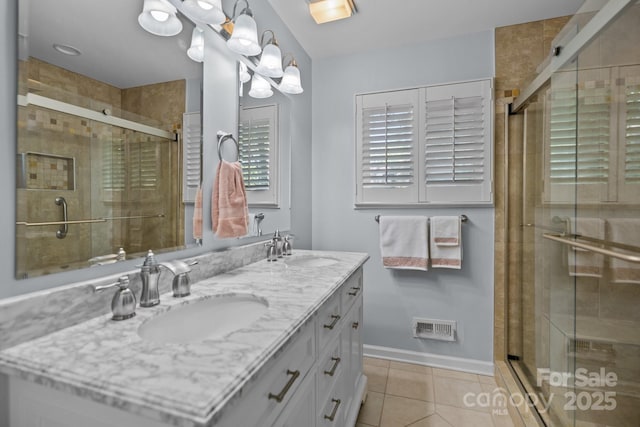 16070 Palawan Ct, Tega Cay, SC 29708 - full bath featuring a shower stall, visible vents, tile patterned flooring, and a sink