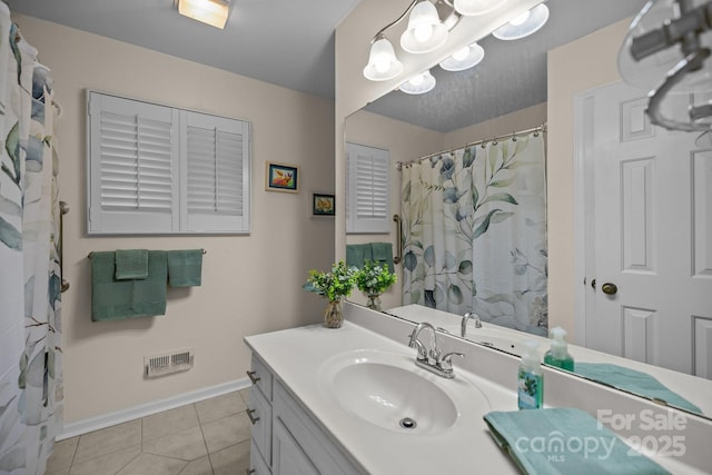 16070 Palawan Ct, Tega Cay, SC 29708 - full bathroom featuring a chandelier, vanity, tile patterned flooring, and baseboards