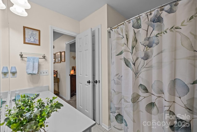 16070 Palawan Ct, Tega Cay, SC 29708 - full bathroom with vanity, tile patterned floors, and curtained shower