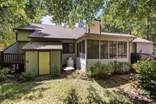 16070 Palawan Ct, Tega Cay, SC 29708 - back of property featuring a sunroom, a chimney, and roof with shingles