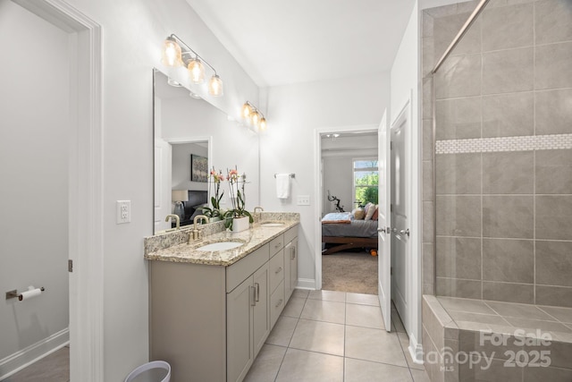 bathroom featuring a sink, a tile shower, ensuite bath, and double vanity