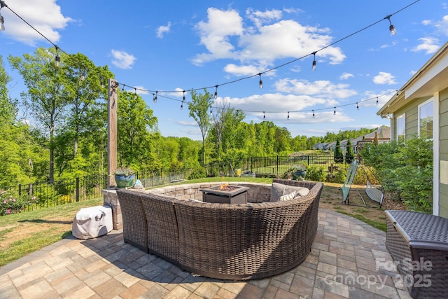 view of patio / terrace with a fenced backyard and an outdoor fire pit