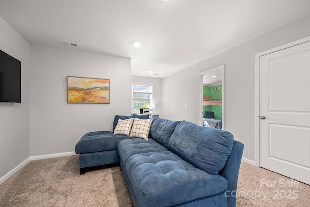 living area with recessed lighting, baseboards, visible vents, and light carpet