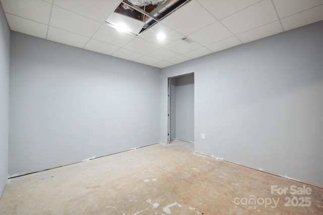 1592 Farmington Hills Dr, Conover, NC 28613 - spare room featuring visible vents, a paneled ceiling, and concrete flooring