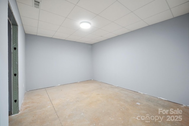 1592 Farmington Hills Dr, Conover, NC 28613 - empty room with visible vents, unfinished concrete floors, and a drop ceiling