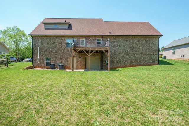 1592 Farmington Hills Dr, Conover, NC 28613 - back of house featuring a lawn, a deck, cooling unit, a garage, and brick siding