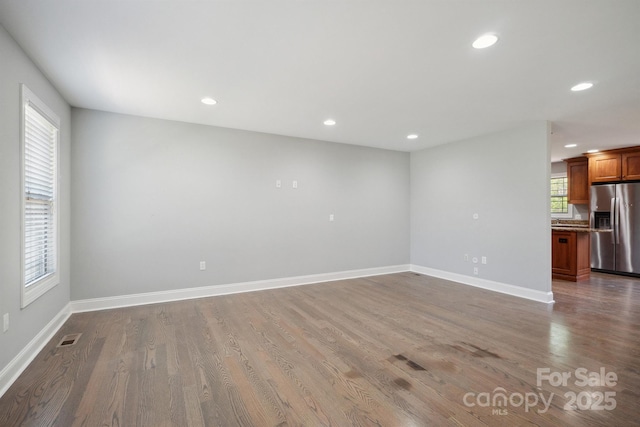 1592 Farmington Hills Dr, Conover, NC 28613 - unfurnished living room featuring baseboards, wood finished floors, visible vents, and recessed lighting