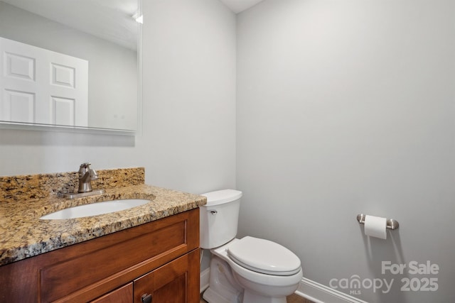 1592 Farmington Hills Dr, Conover, NC 28613 - bathroom featuring baseboards, toilet, and vanity