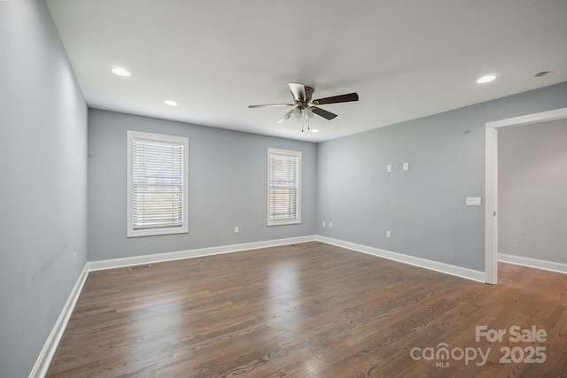1592 Farmington Hills Dr, Conover, NC 28613 - spare room with recessed lighting, a healthy amount of sunlight, a ceiling fan, and dark wood-style floors