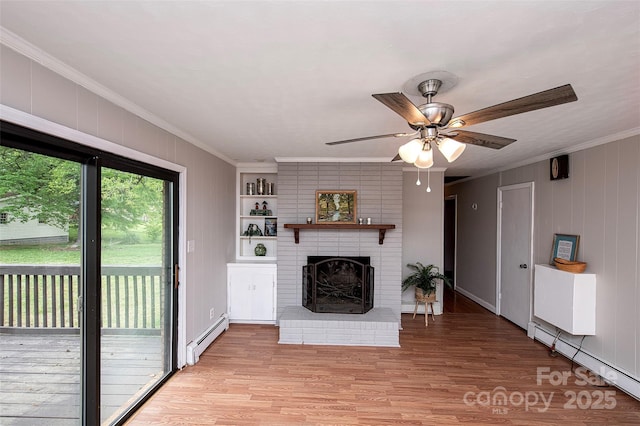 134 Piedmont Dr, Kannapolis, NC 28081 - unfurnished living room featuring light wood finished floors, crown molding, a baseboard radiator, a brick fireplace, and ceiling fan