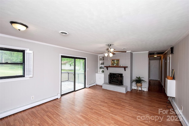 134 Piedmont Dr, Kannapolis, NC 28081 - unfurnished living room with a baseboard radiator, light wood-style floors, a brick fireplace, and baseboard heating