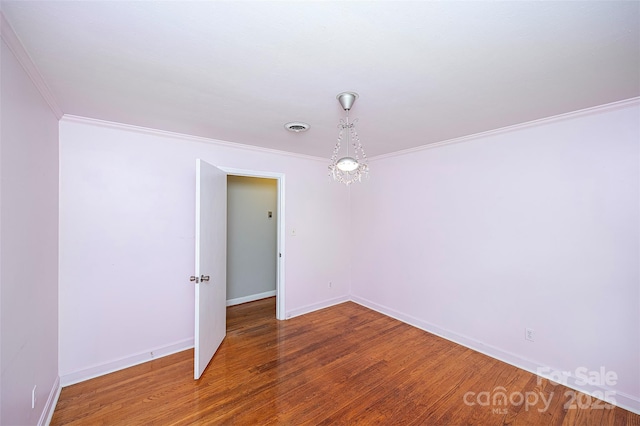 134 Piedmont Dr, Kannapolis, NC 28081 - unfurnished room featuring baseboards, crown molding, wood finished floors, and visible vents
