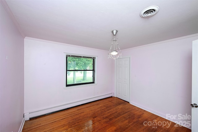 134 Piedmont Dr, Kannapolis, NC 28081 - unfurnished room featuring wood finished floors, visible vents, crown molding, and baseboard heating