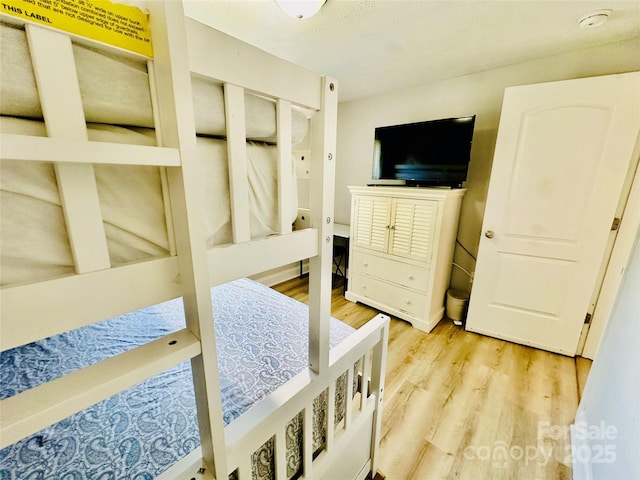 bedroom featuring light wood finished floors