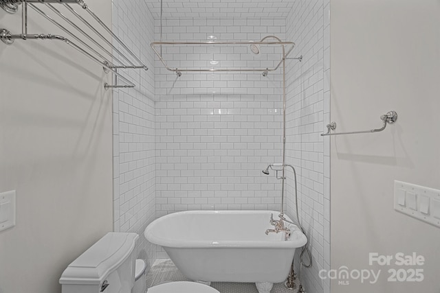 full bathroom with a shower, toilet, and a freestanding bath