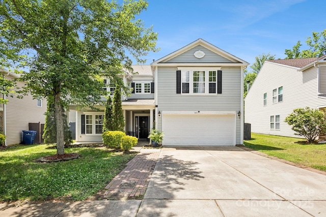 5611 Hammermill Dr, Harrisburg, NC 28075 - traditional home with a garage, driveway, and a front yard