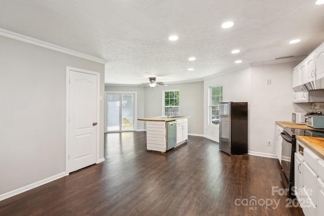 5611 Hammermill Dr, Harrisburg, NC 28075 - kitchen featuring stainless steel appliances, butcher block countertops, recessed lighting, crown molding, and white cabinets