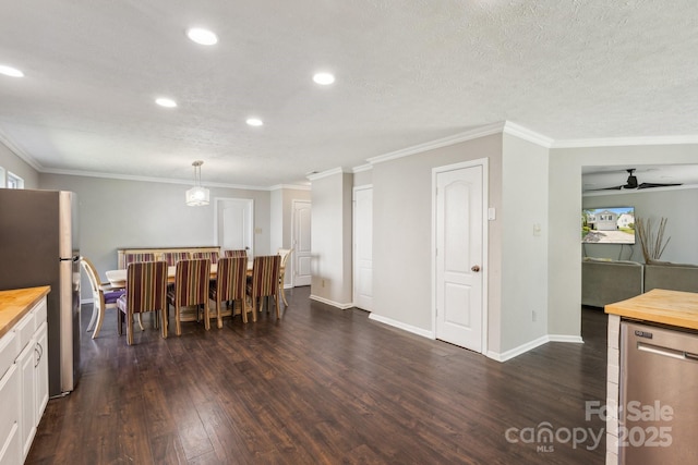 5611 Hammermill Dr, Harrisburg, NC 28075 - dining area with dark wood-style flooring, a ceiling fan, recessed lighting, ornamental molding, and baseboards