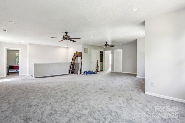 5611 Hammermill Dr, Harrisburg, NC 28075 - unfurnished living room featuring baseboards, a textured ceiling, carpet floors, recessed lighting, and a ceiling fan