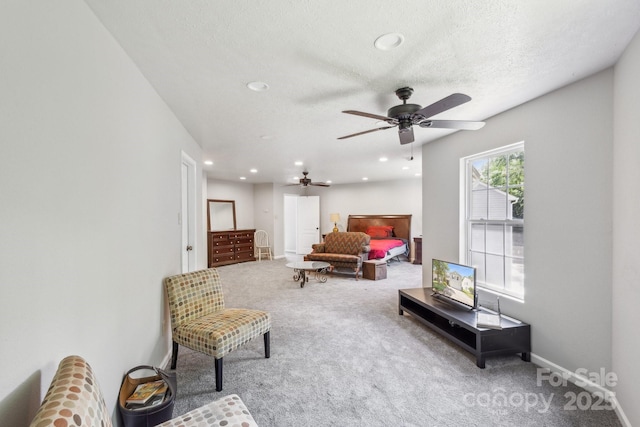 5611 Hammermill Dr, Harrisburg, NC 28075 - carpeted living room with ceiling fan, recessed lighting, baseboards, and a textured ceiling