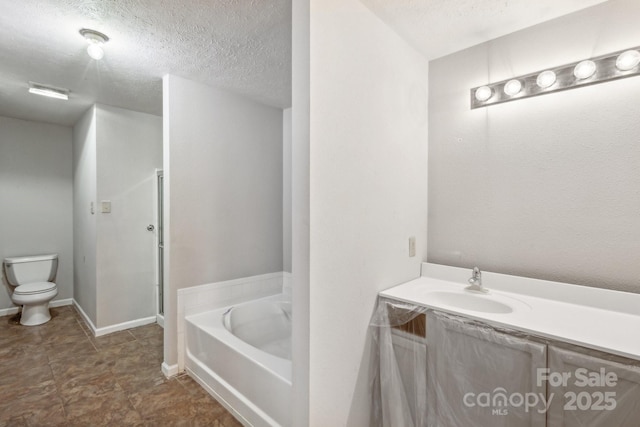 5611 Hammermill Dr, Harrisburg, NC 28075 - bathroom featuring toilet, a garden tub, a shower with door, a textured ceiling, and vanity