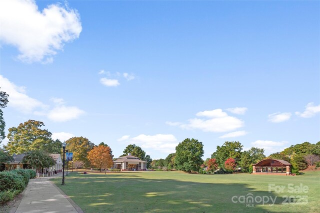 view of home's community with a gazebo and a lawn