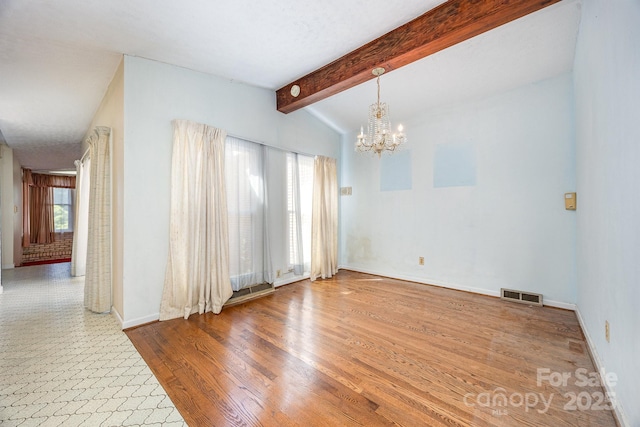 unfurnished dining area with a chandelier, baseboards, and wood finished floors