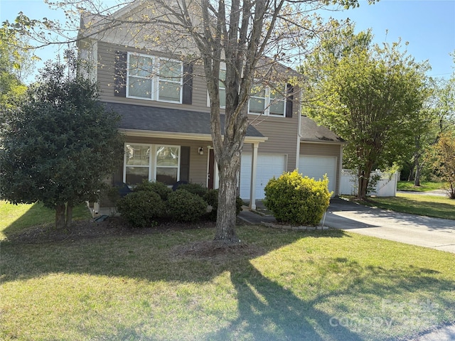 1104 Valley St, Statesville, NC 28677 - view of front of house with driveway, a front lawn, a shingled roof, and a garage
