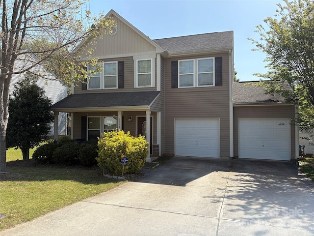 1104 Valley St, Statesville, NC 28677 - view of front of property featuring driveway, board and batten siding, a front lawn, roof with shingles, and an attached garage