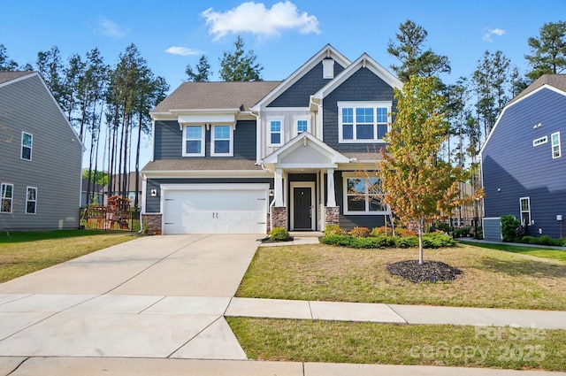 craftsman-style house with driveway, stone siding, a garage, and a front lawn