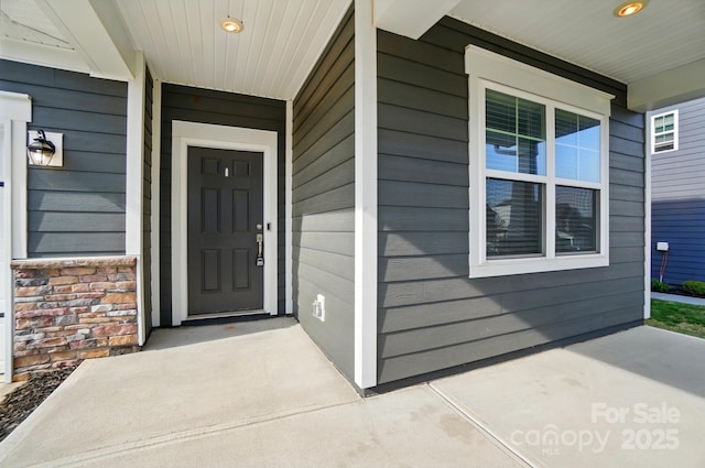doorway to property featuring a porch