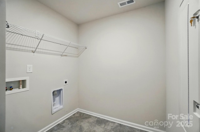 clothes washing area featuring laundry area, electric dryer hookup, visible vents, washer hookup, and baseboards