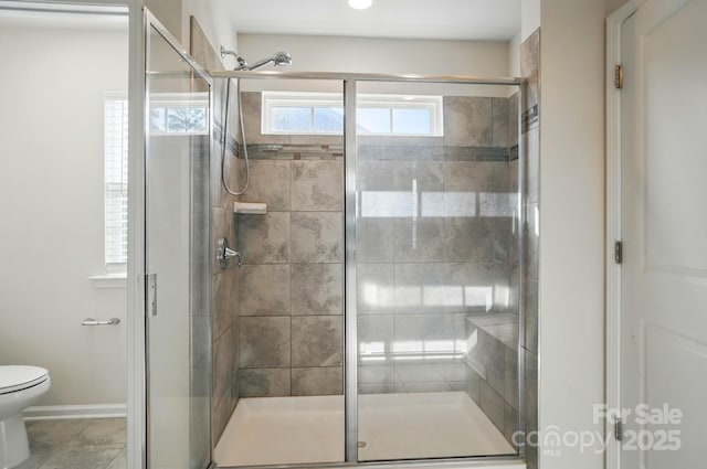 full bathroom with toilet, baseboards, a shower stall, and recessed lighting