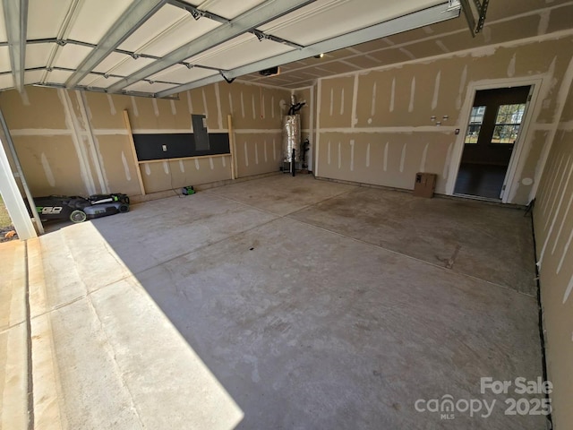 garage with gas water heater and a garage door opener