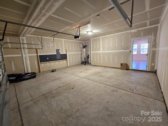 garage featuring a garage door opener