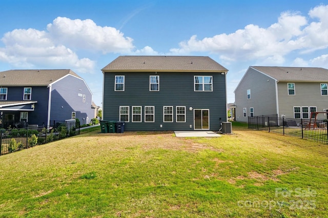 back of property with a patio area, a fenced backyard, a yard, and central AC