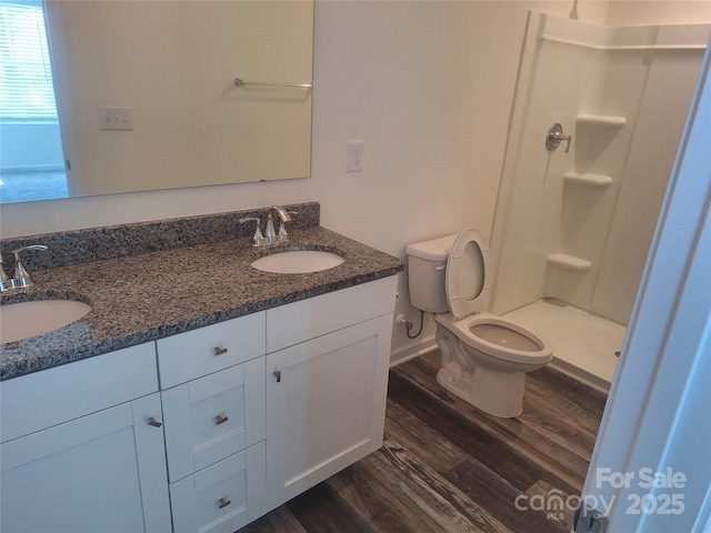 405 N Mulberry St, Cherryville, NC 28021 - full bath with a stall shower, a sink, toilet, and wood finished floors