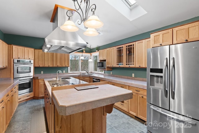 3670 Maple Creek Rd, Rutherfordton, NC 28139 - kitchen featuring stainless steel appliances, a skylight, a center island with sink, a sink, and vaulted ceiling