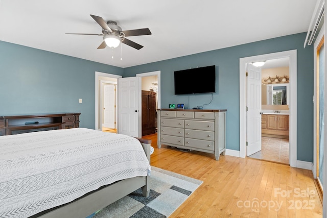 3670 Maple Creek Rd, Rutherfordton, NC 28139 - bedroom with ensuite bathroom, light wood finished floors, baseboards, a ceiling fan, and a sink