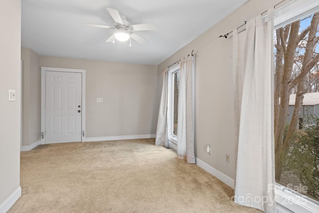 3670 Maple Creek Rd, Rutherfordton, NC 28139 - unfurnished room featuring light colored carpet, plenty of natural light, ceiling fan, and baseboards