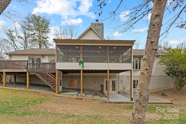 3670 Maple Creek Rd, Rutherfordton, NC 28139 - rear view of property featuring a sunroom, a chimney, a patio area, and a wooden deck