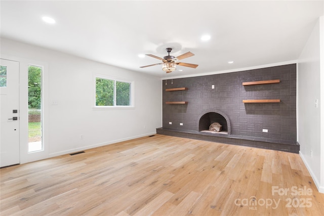 1904 27th Avenue Dr NE, Hickory, NC 28601 - unfurnished living room with a fireplace, baseboards, a ceiling fan, light wood-style floors, and recessed lighting