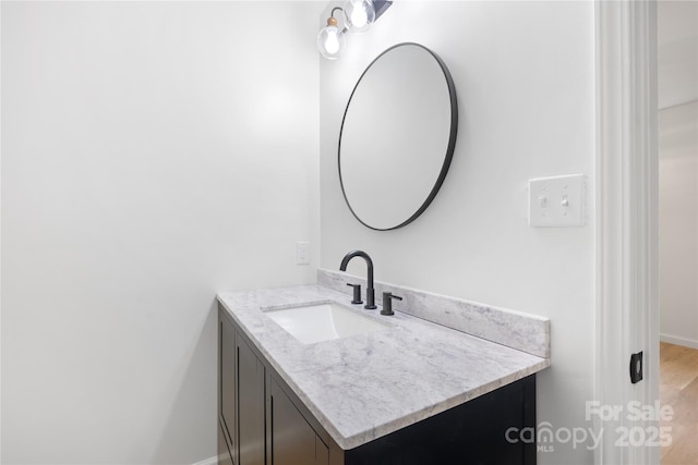 1904 27th Avenue Dr NE, Hickory, NC 28601 - bathroom with vanity, baseboards, and wood finished floors