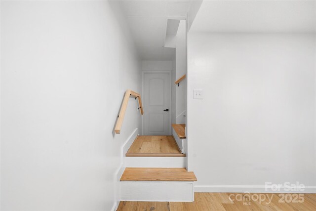 1904 27th Avenue Dr NE, Hickory, NC 28601 - staircase featuring wood finished floors and baseboards