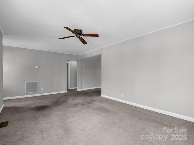 unfurnished room featuring baseboards, visible vents, carpet, and ceiling fan