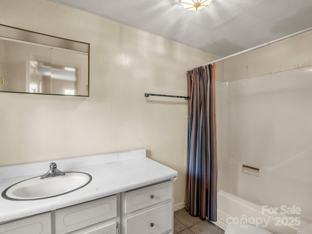 full bath with tile patterned floors, vanity, and shower / bathtub combination with curtain