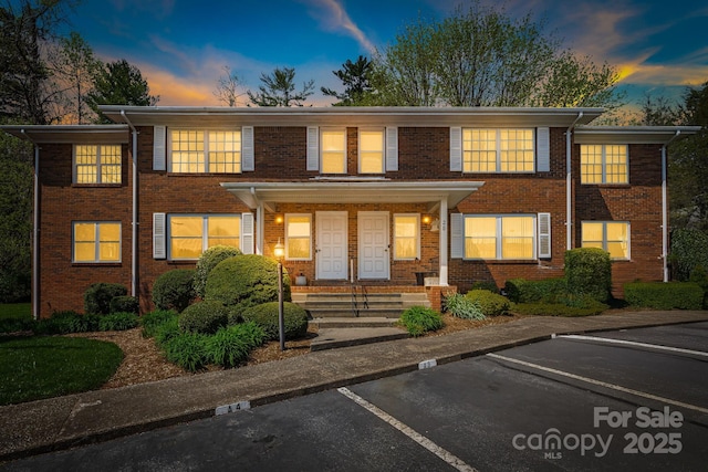28 Capri Ln Unit 3A, Hendersonville, NC 28792 - view of front facade with uncovered parking and brick siding