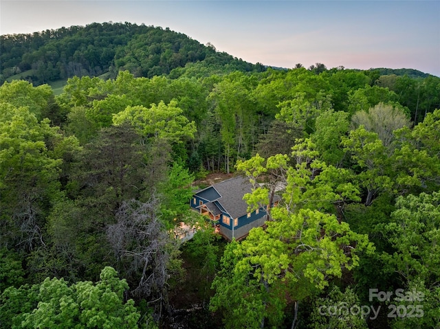 drone / aerial view with a view of trees