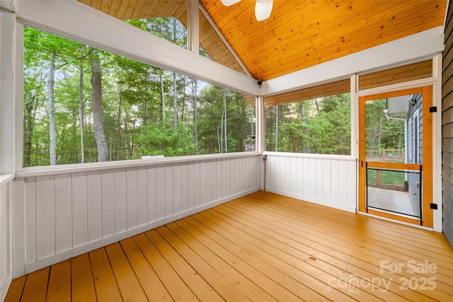 unfurnished sunroom featuring ceiling fan
