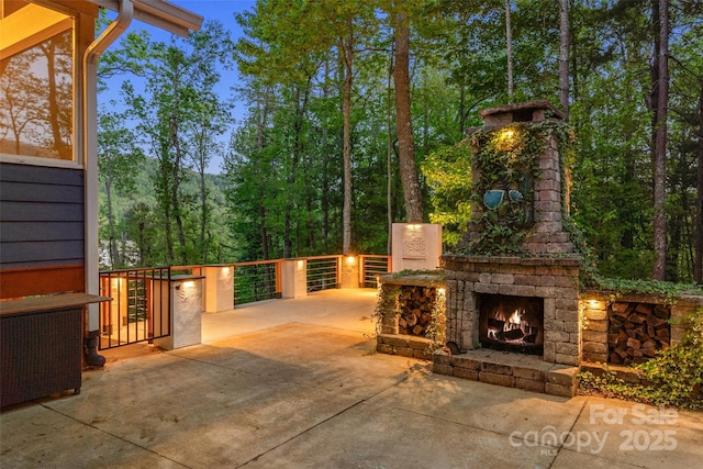 view of patio / terrace with an outdoor stone fireplace